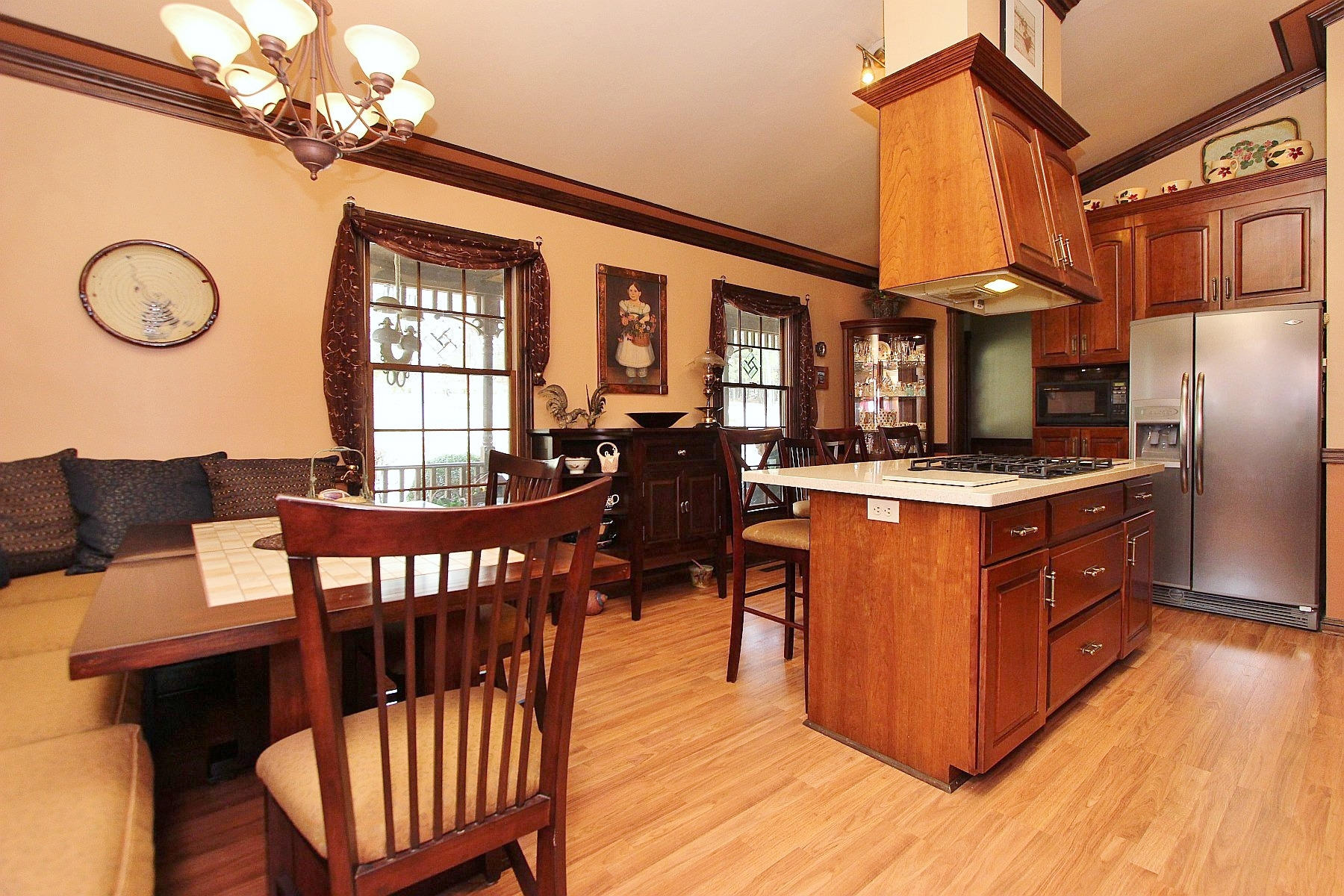 1282 Sunny Ridge Road Northeast Floyd, VA 24091 - Photo 17 of 53 a view of a dining room with furniture a chandelier and wooden floor