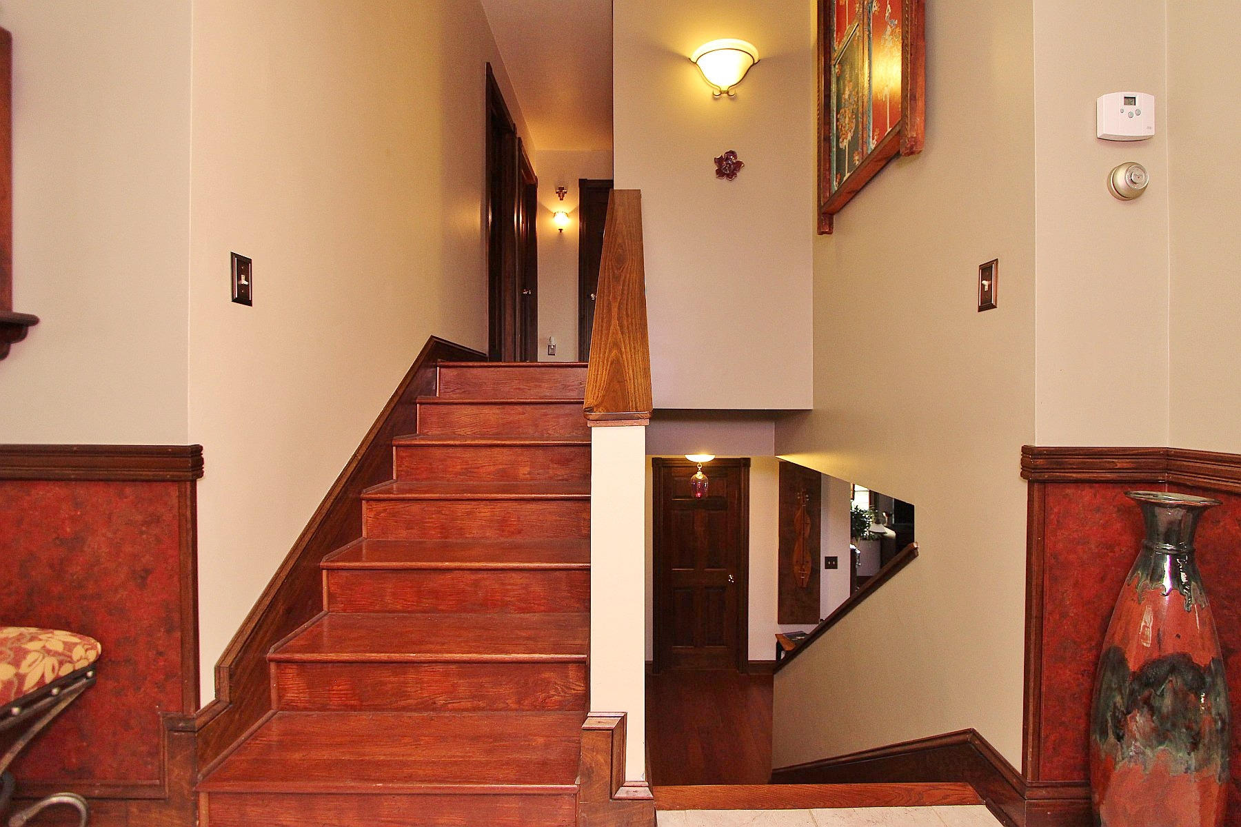 1282 Sunny Ridge Road Northeast Floyd, VA 24091 - Photo 18 of 53 a view of staircase with lots of frames on wall and a chandelier