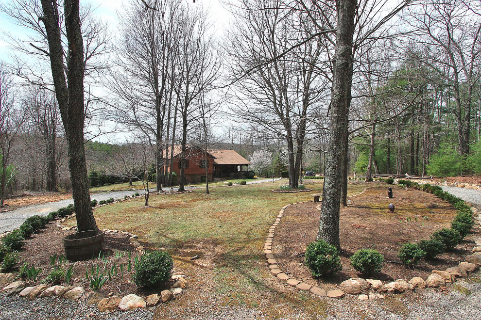 1282 Sunny Ridge Road Northeast Floyd, VA 24091 - Photo 3 of 53 a tree in the middle of a yard
