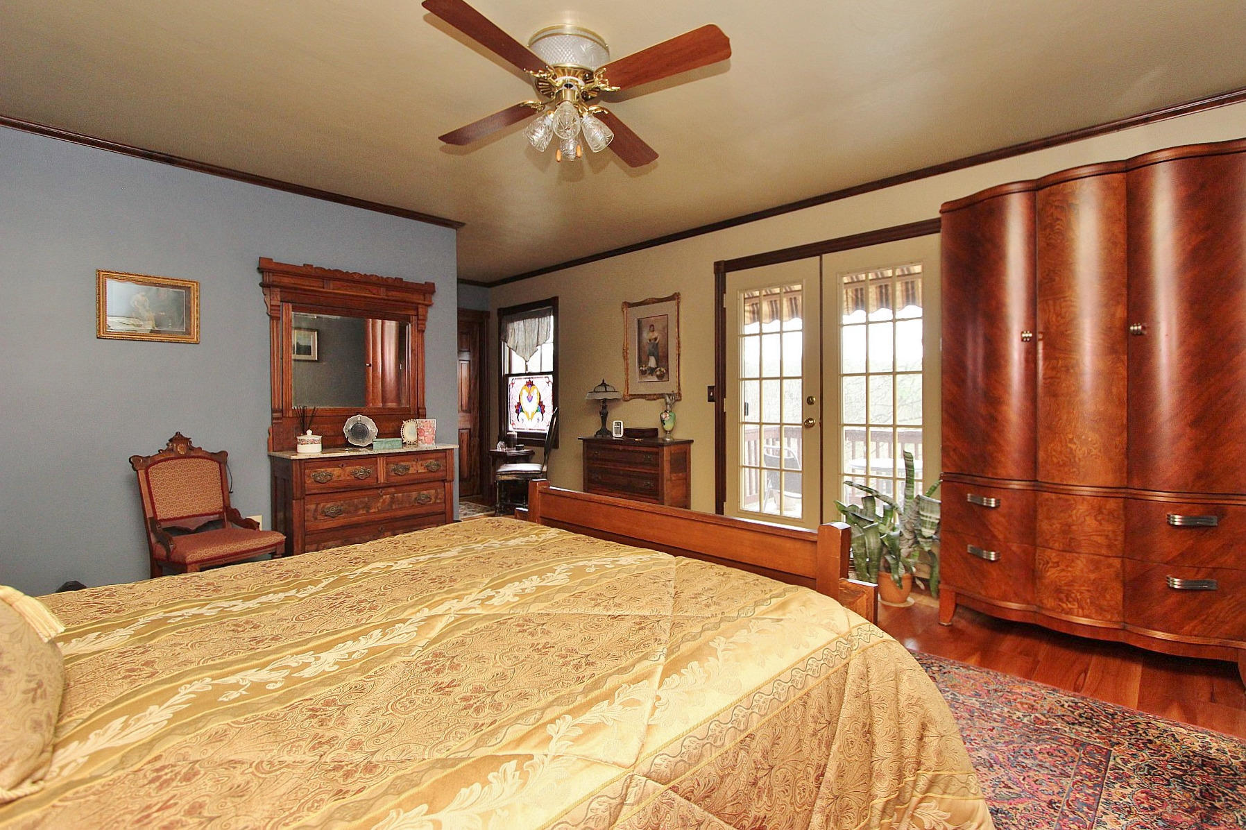 1282 Sunny Ridge Road Northeast Floyd, VA 24091 - Photo 22 of 53 a bedroom with a large bed and a chandelier