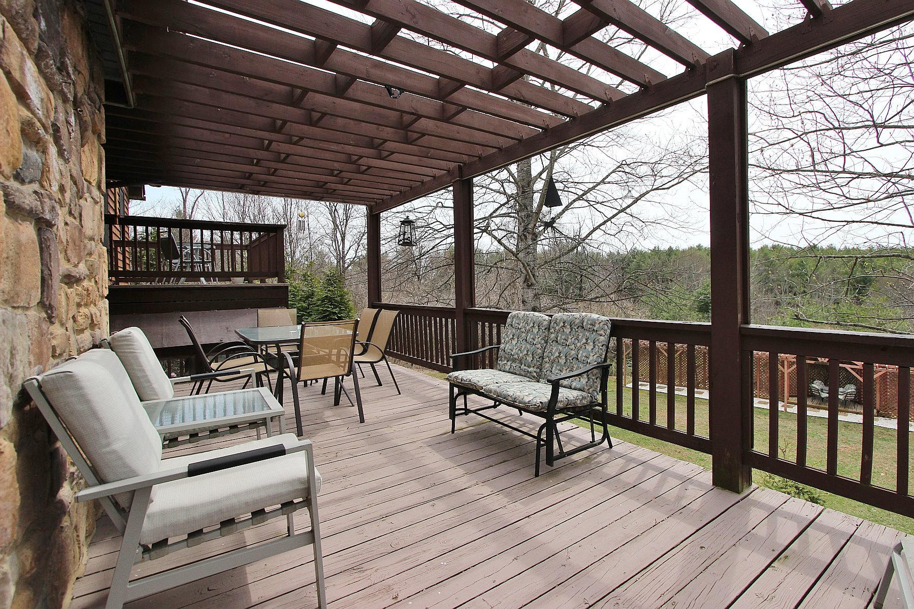 1282 Sunny Ridge Road Northeast Floyd, VA 24091 - Photo 33 of 53 a view of a chairs and table on the deck