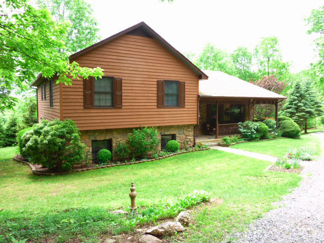 1282 Sunny Ridge Road Northeast Floyd, VA 24091 - Photo 47 of 53 a front view of a house with garden