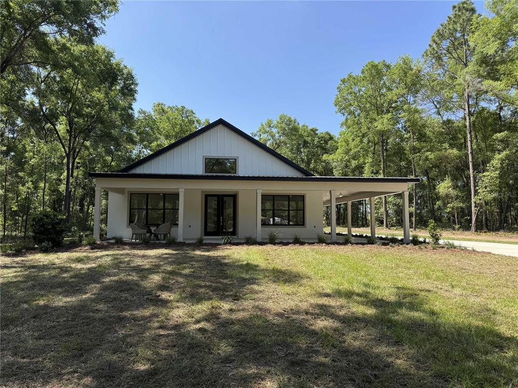 18890 Southwest 60th Street Dunnellon, FL 34432 - Photo 1 of 1 a front view of a house with a yard