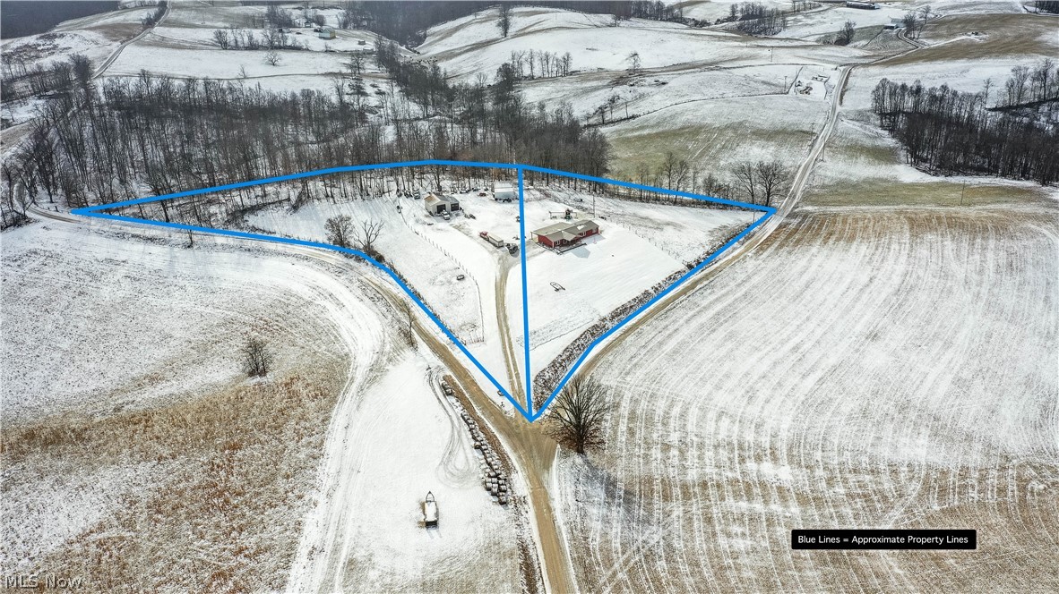 83101 Smith Road Cadiz, OH 43907 - Photo 32 of 35 83101 Smith Rd, Cadiz, OH 43907 is an awesome homesite with beautiful views of the surrounding terrain under 3 miles to Tappan Lake with ranch just under 5 acres of land, 3-4 bedrooms, 2 full baths, family room with wood burning stove, Living Room, mega rear covered patio, huge front deck, with 24x30 horse & hog barn with hay loft & huge 23x30 garage with 2 large overhead doors. Rare opportunity for this updated slice of paradise!