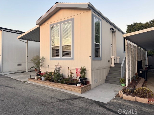 a front view of a house with many windows