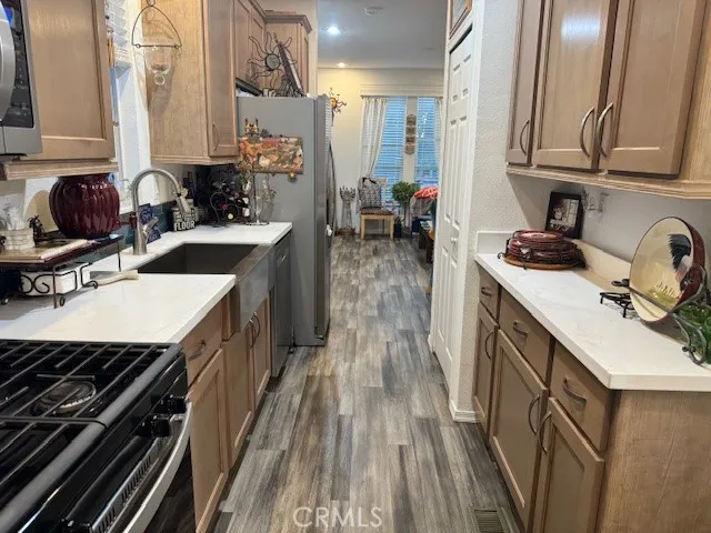 a kitchen with a sink stove and cabinets