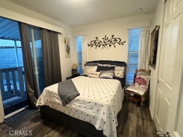 a bedroom with a bed and a mirror