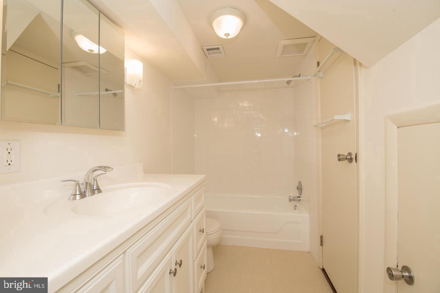 2201 Kater Street Philadelphia, PA 19146 - Photo 4 of 9 a bathroom with a sink a toilet and shower