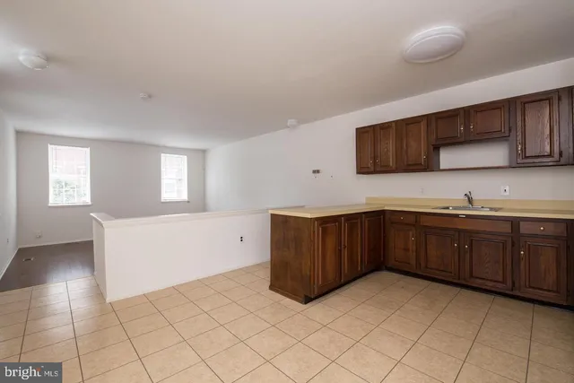 a kitchen with stainless steel appliances granite countertop a sink and cabinets