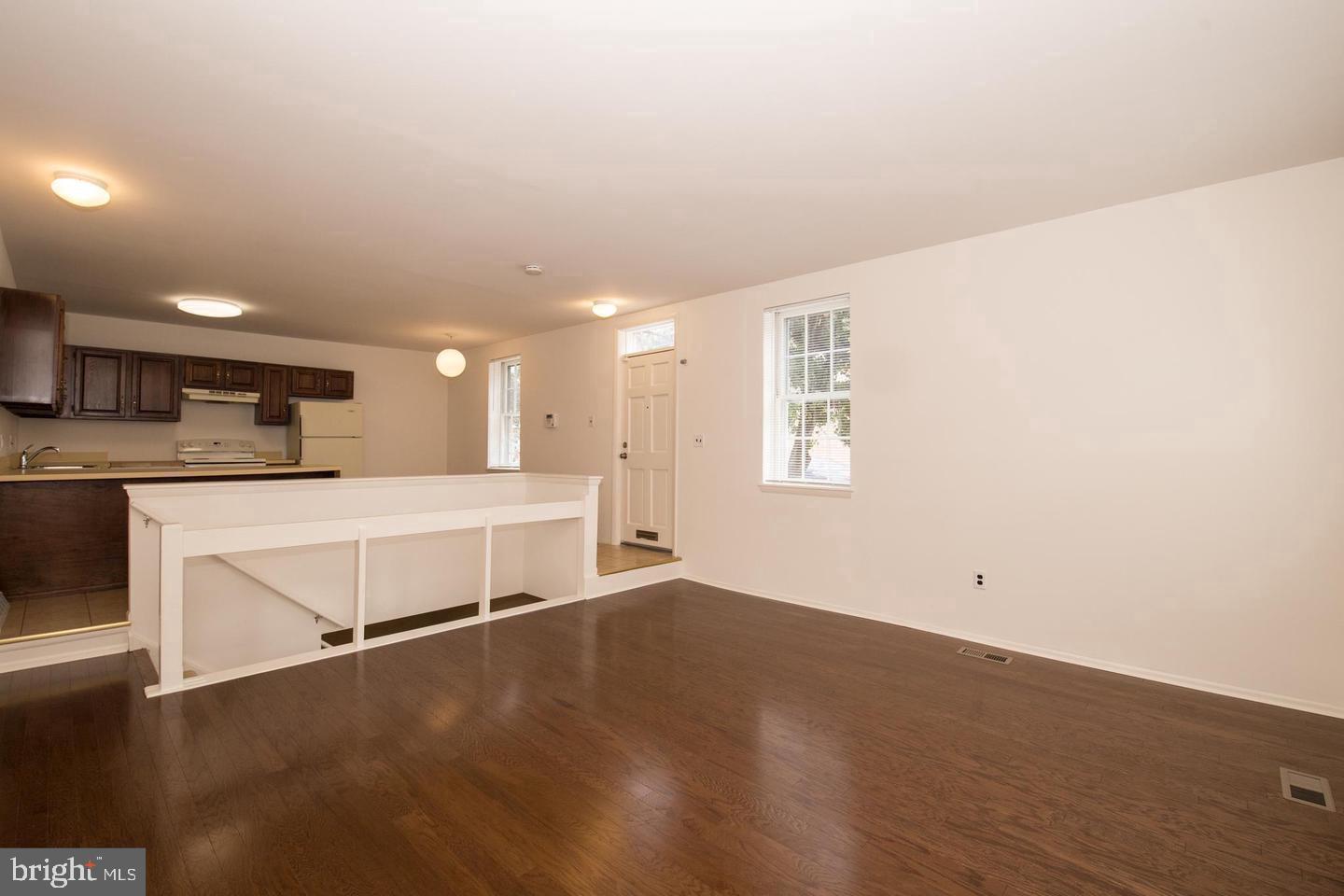 2201 Kater Street Philadelphia, PA 19146 - Photo 8 of 9 an empty room with wooden floor and windows