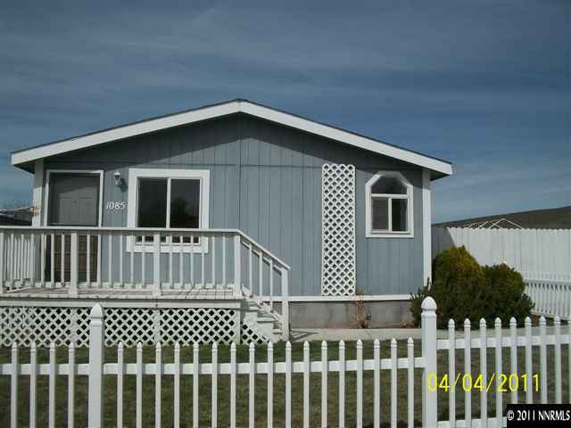 1085 Chisholm Trail Reno, NV 89506 - Photo 1 of 13 a front view of a house with a deck