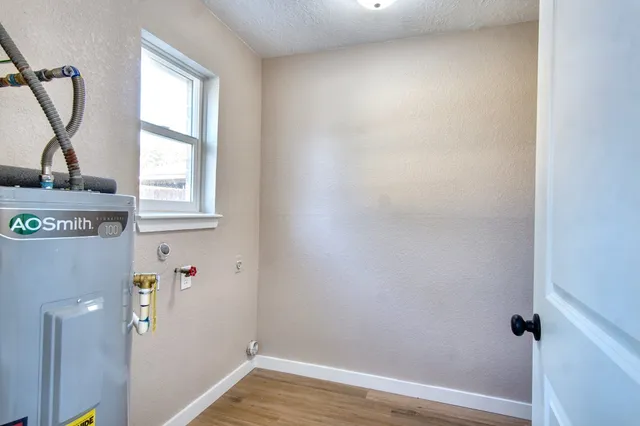 a front view of a house with a garden and plants