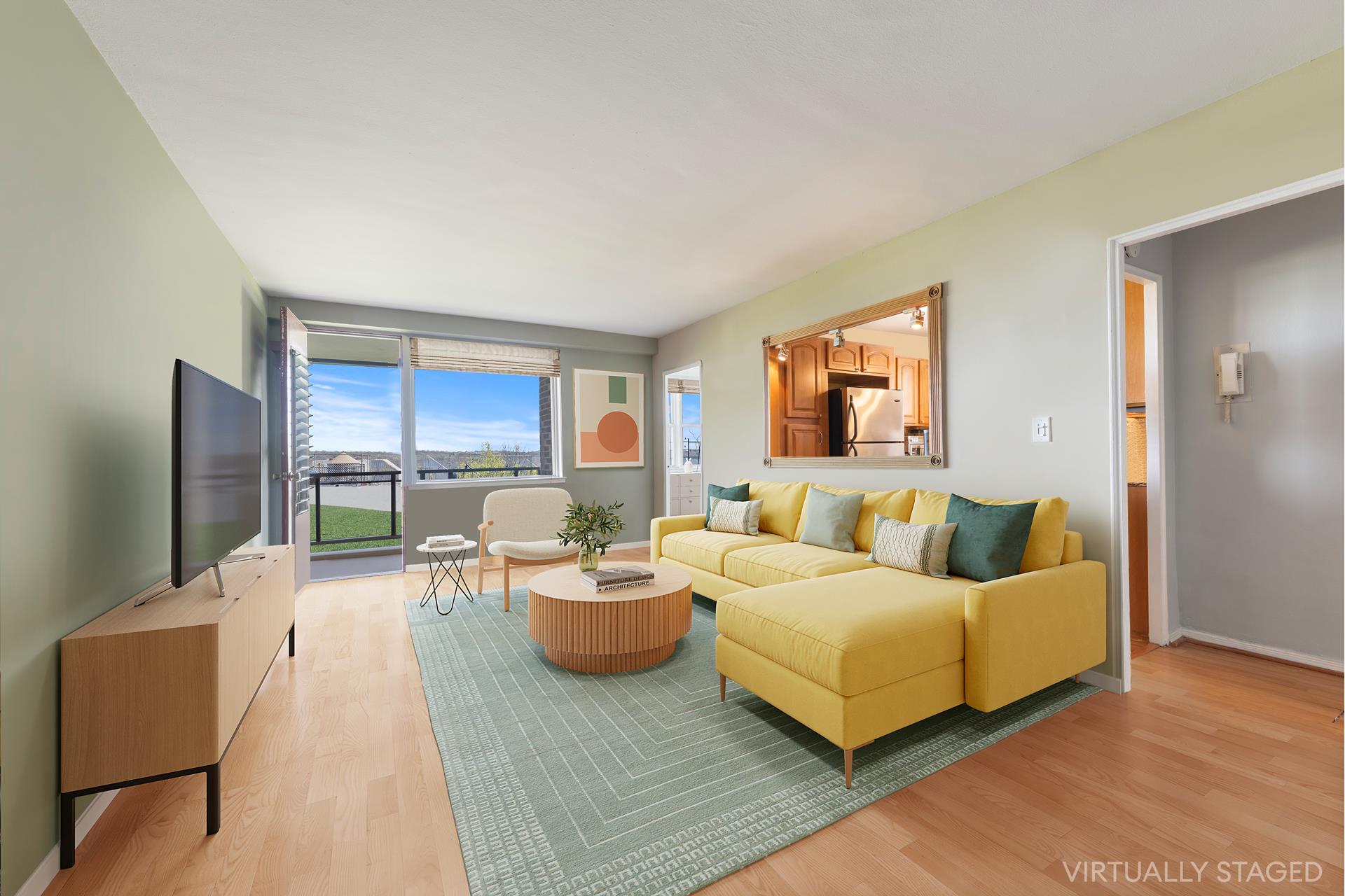 a living room with furniture wooden floor and a flat screen tv