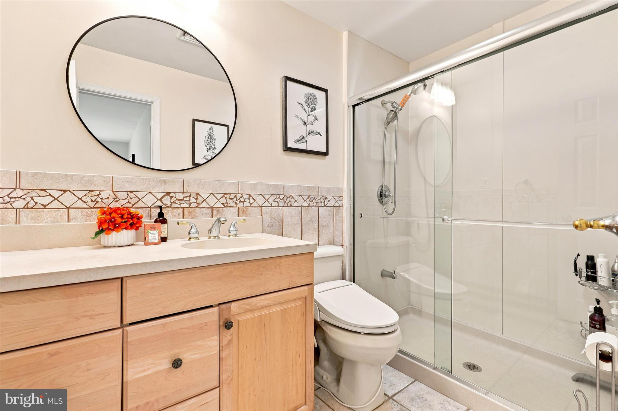 3155 Manor Road Huntingdon Valley, PA 19006 - Photo 17 of 31 a bathroom with a sink a mirror a vanity and a shower