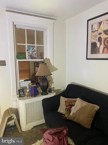 a room with a chandelier and couch