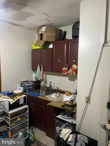 a view of a patio with table and chairs