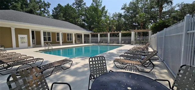 a view of a park with large trees