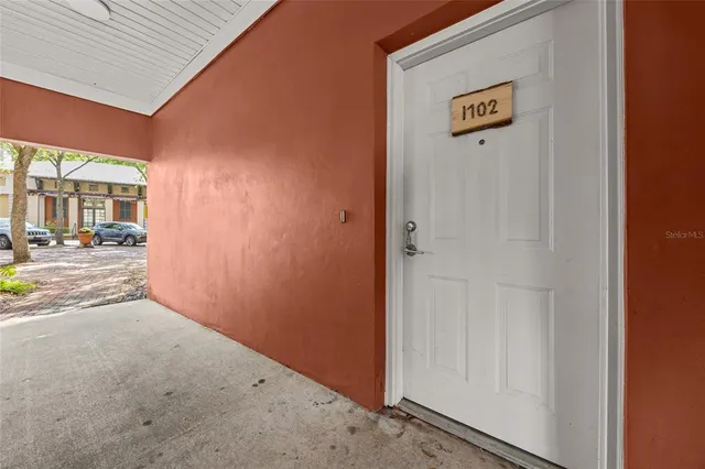 a view of a hallway with a room