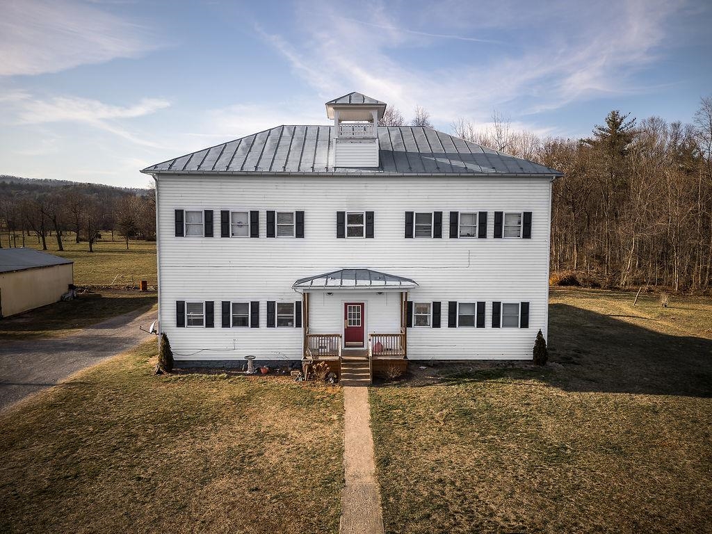 7376 Community Center Road Bridgewater, VA 22812 - Photo 6 of 18 a front view of a house with a yard