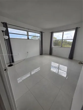 a bathroom with a double vanity sink toilet and a mirror