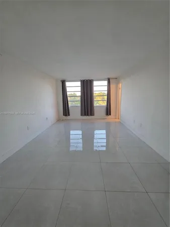 a view of a hallway with windows