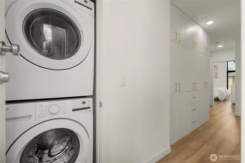 a view of a hallway with washer and dryer