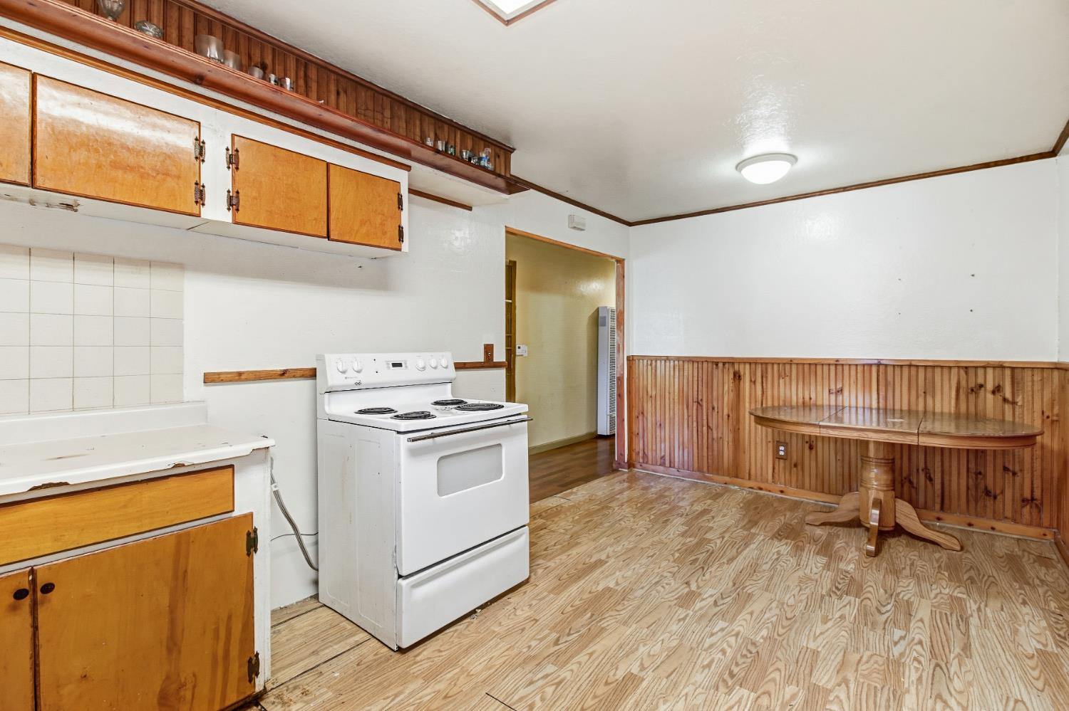 7334 Doc Adams Road Marysville, CA 95901 - Photo 12 of 30 a kitchen with a stove and a refrigerator
