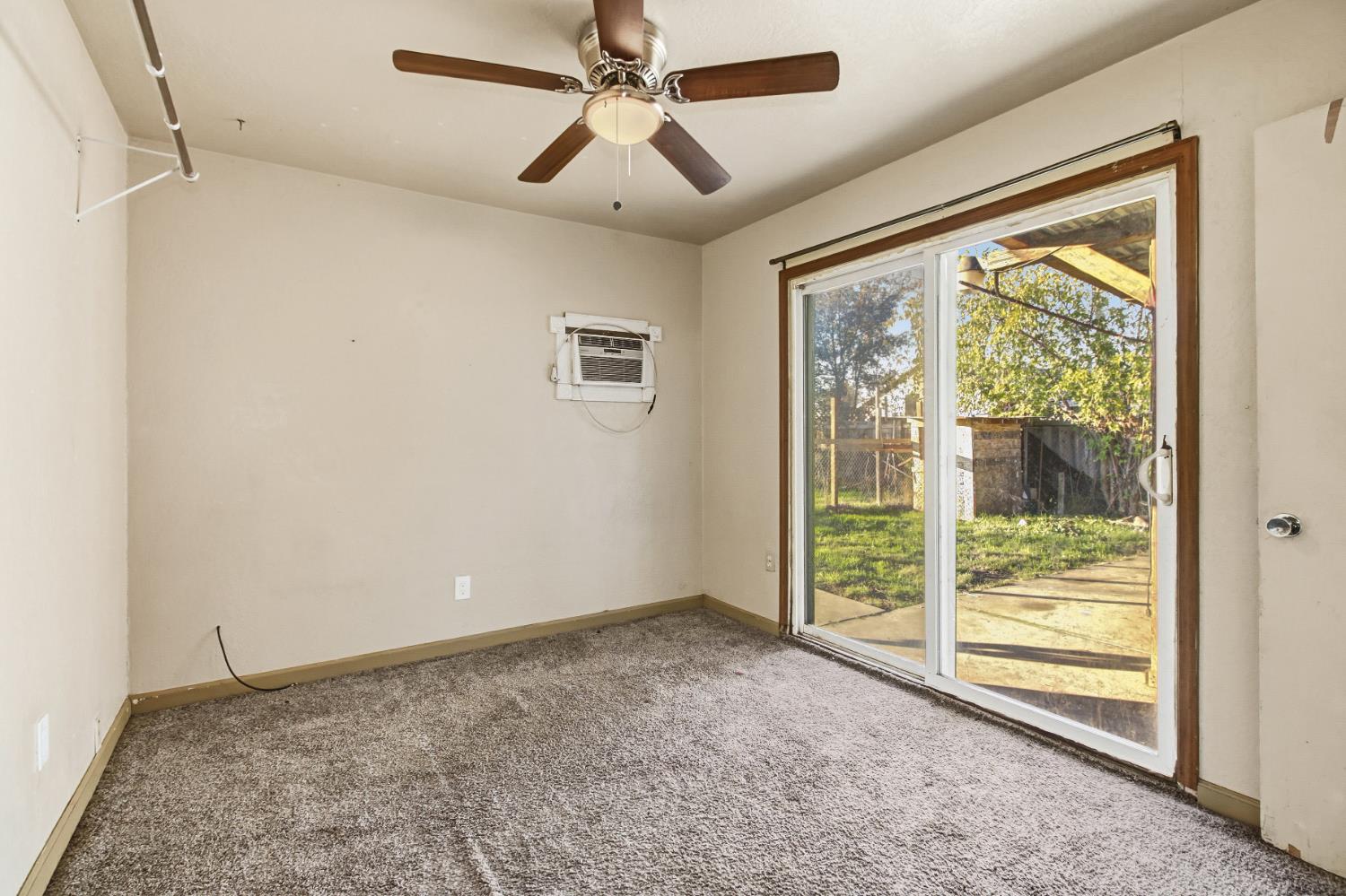 7334 Doc Adams Road Marysville, CA 95901 - Photo 15 of 30 a view of room with window and ceiling fan