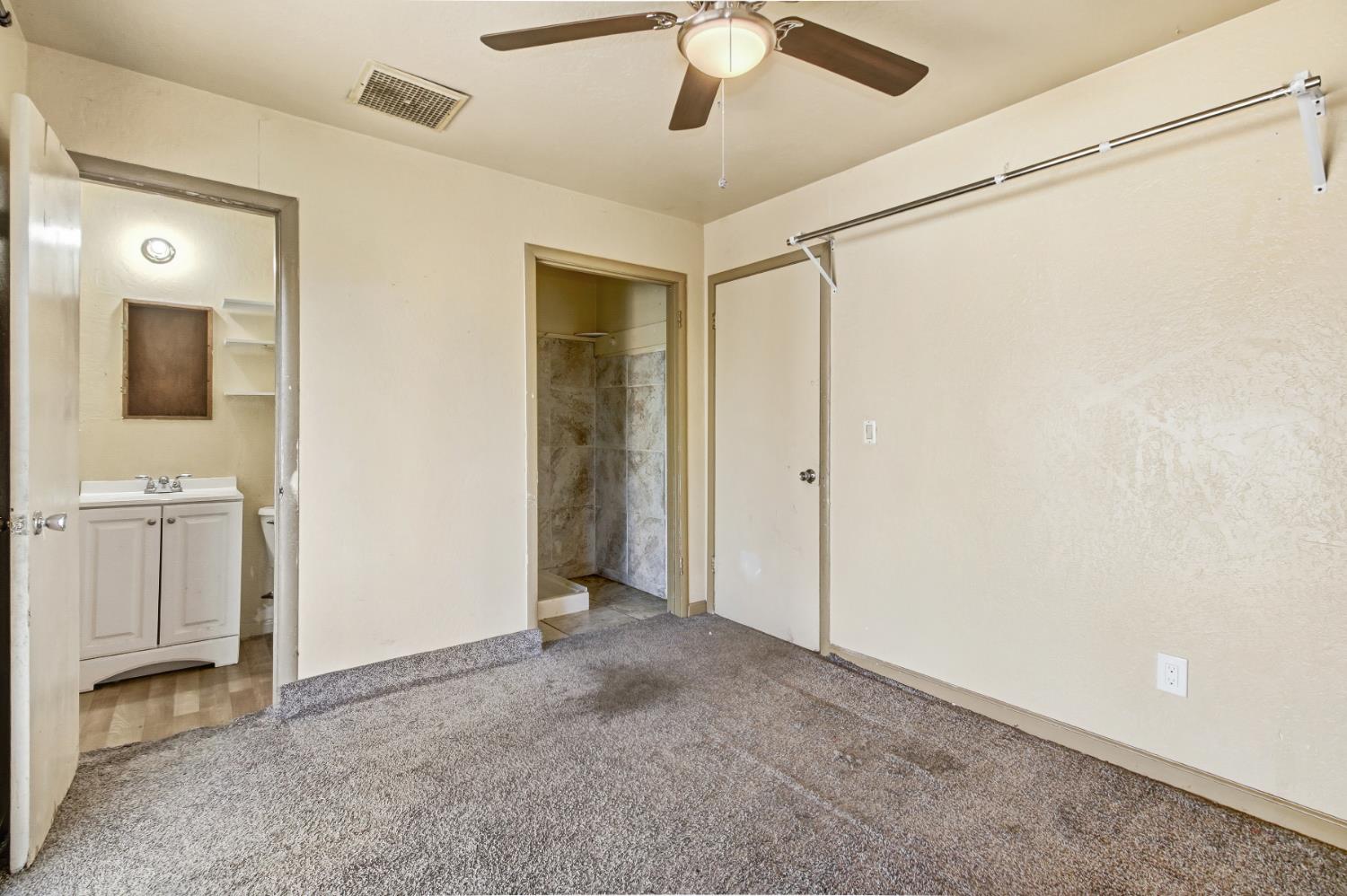 7334 Doc Adams Road Marysville, CA 95901 - Photo 17 of 30 a view of a bathroom with a sink and a mirror