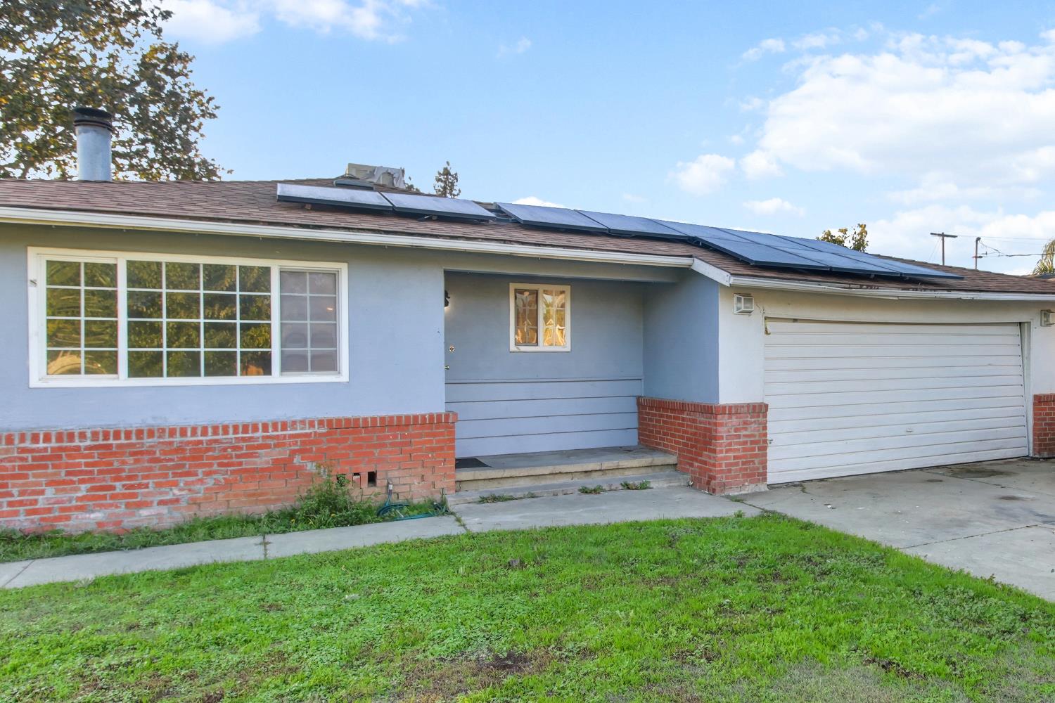 7334 Doc Adams Road Marysville, CA 95901 - Photo 2 of 30 a front view of a house with a garden