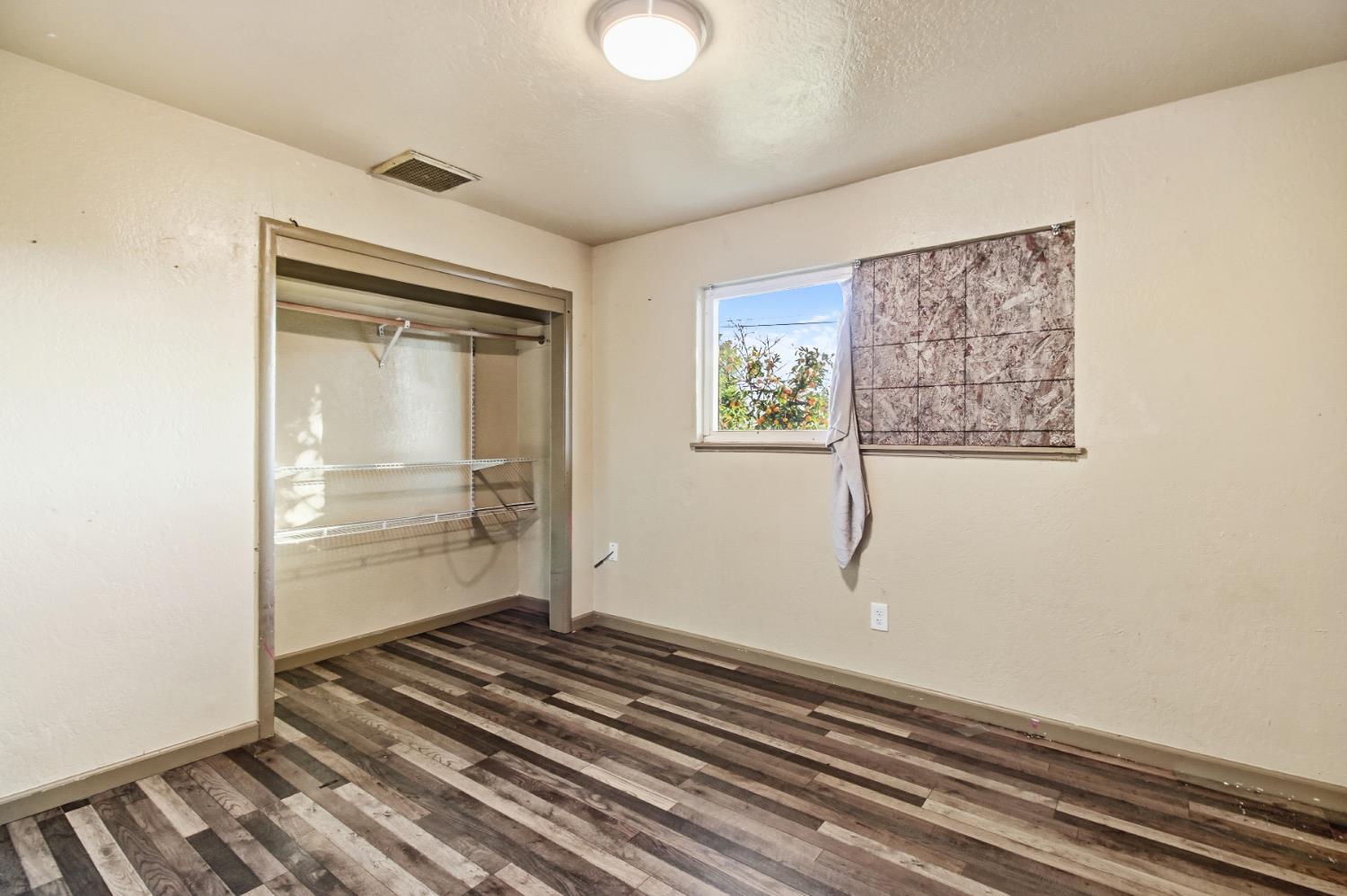 7334 Doc Adams Road Marysville, CA 95901 - Photo 21 of 30 a room with walk in closet and a window