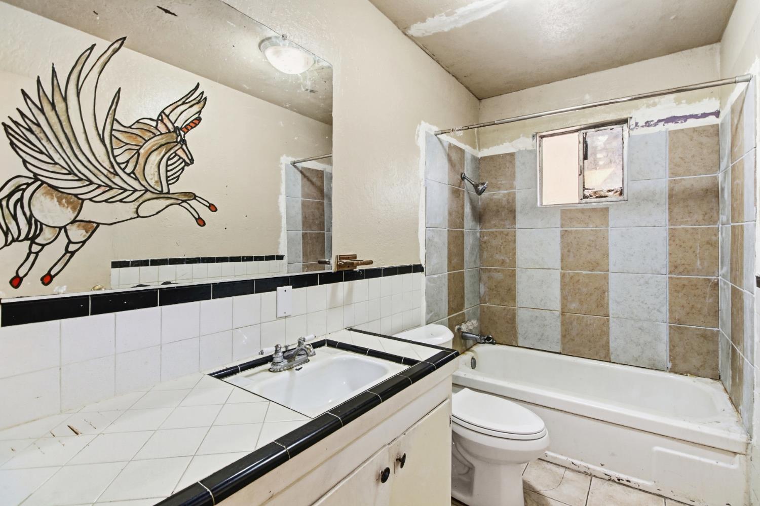 7334 Doc Adams Road Marysville, CA 95901 - Photo 24 of 30 a bathroom with a sink a toilet and shower