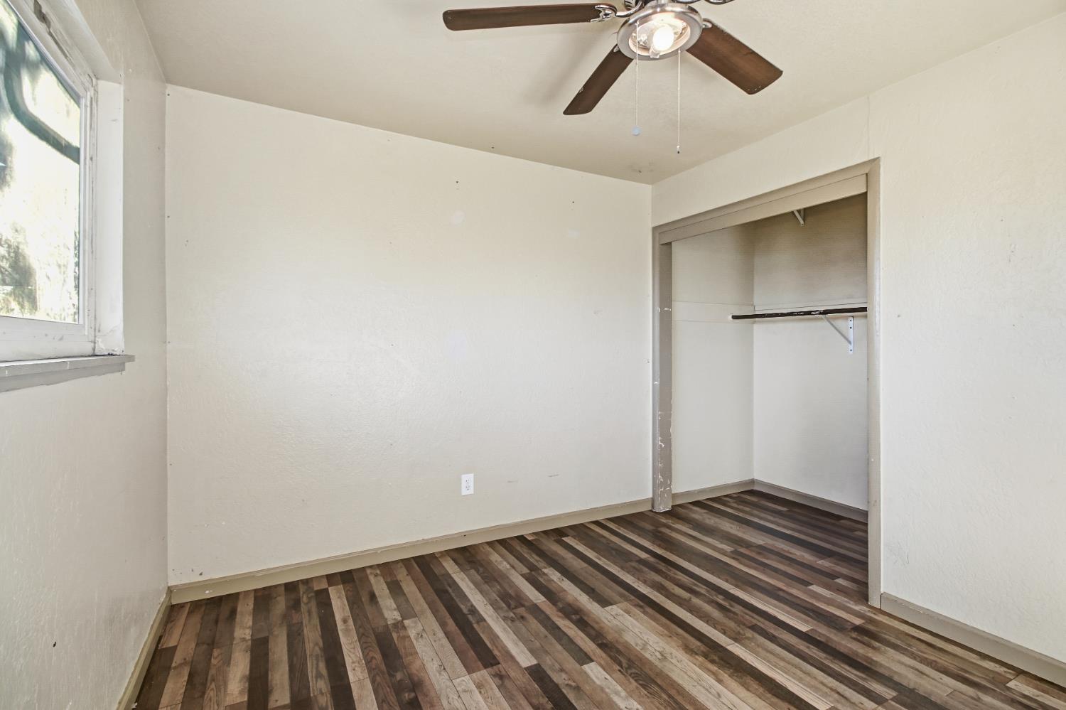 7334 Doc Adams Road Marysville, CA 95901 - Photo 27 of 30 a view of room with window and ceiling fan