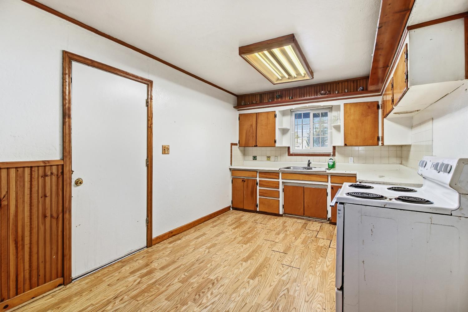 7334 Doc Adams Road Marysville, CA 95901 - Photo 9 of 30 a kitchen with stainless steel appliances granite countertop a stove sink and cabinets