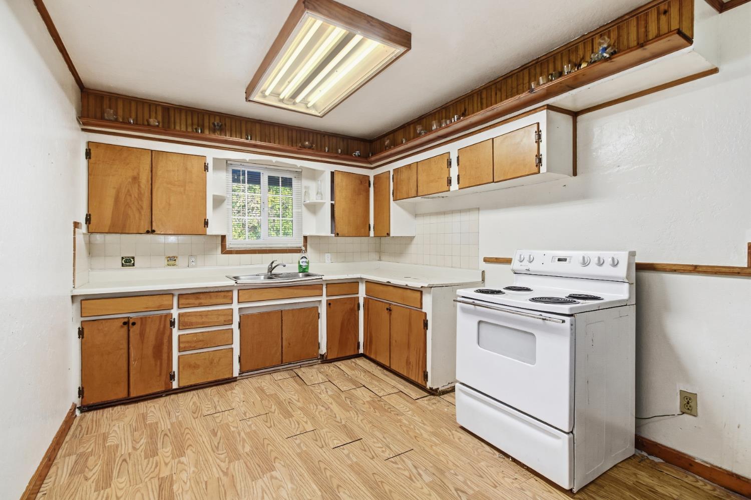 7334 Doc Adams Road Marysville, CA 95901 - Photo 10 of 30 a kitchen with stainless steel appliances granite countertop a stove and a sink