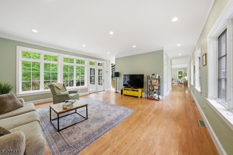 156 Kingsland Road Boonton, NJ 07005 - Photo 15 of 38 a living room with furniture a flat screen tv and a large window