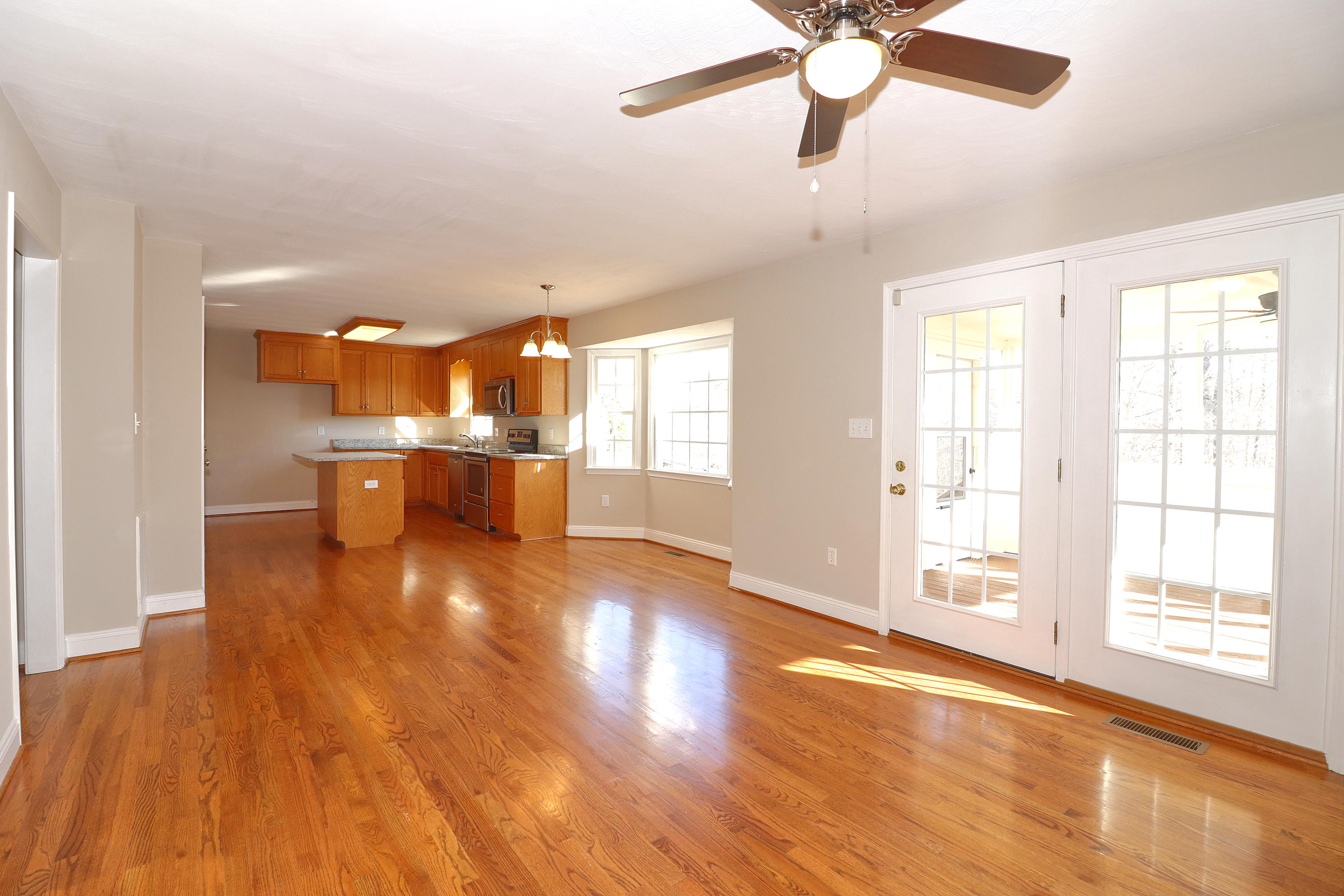 2232 Navigation Point Goodview, VA 24095 - Photo 8 of 27 a view of a livingroom with a window and wooden floor