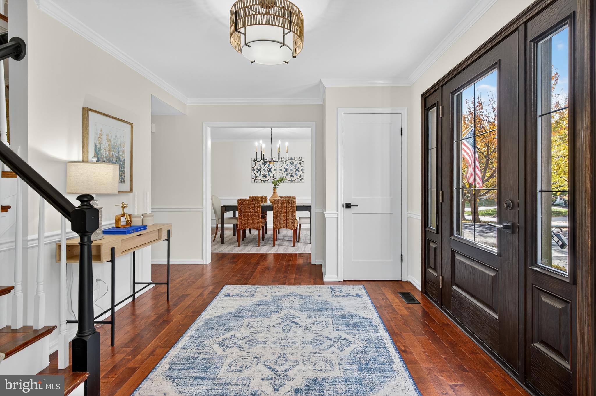 12100 Triple Crown Road North Potomac, MD 20878 - Photo 11 of 66 a hallway with wooden floor chandelier and entryway
