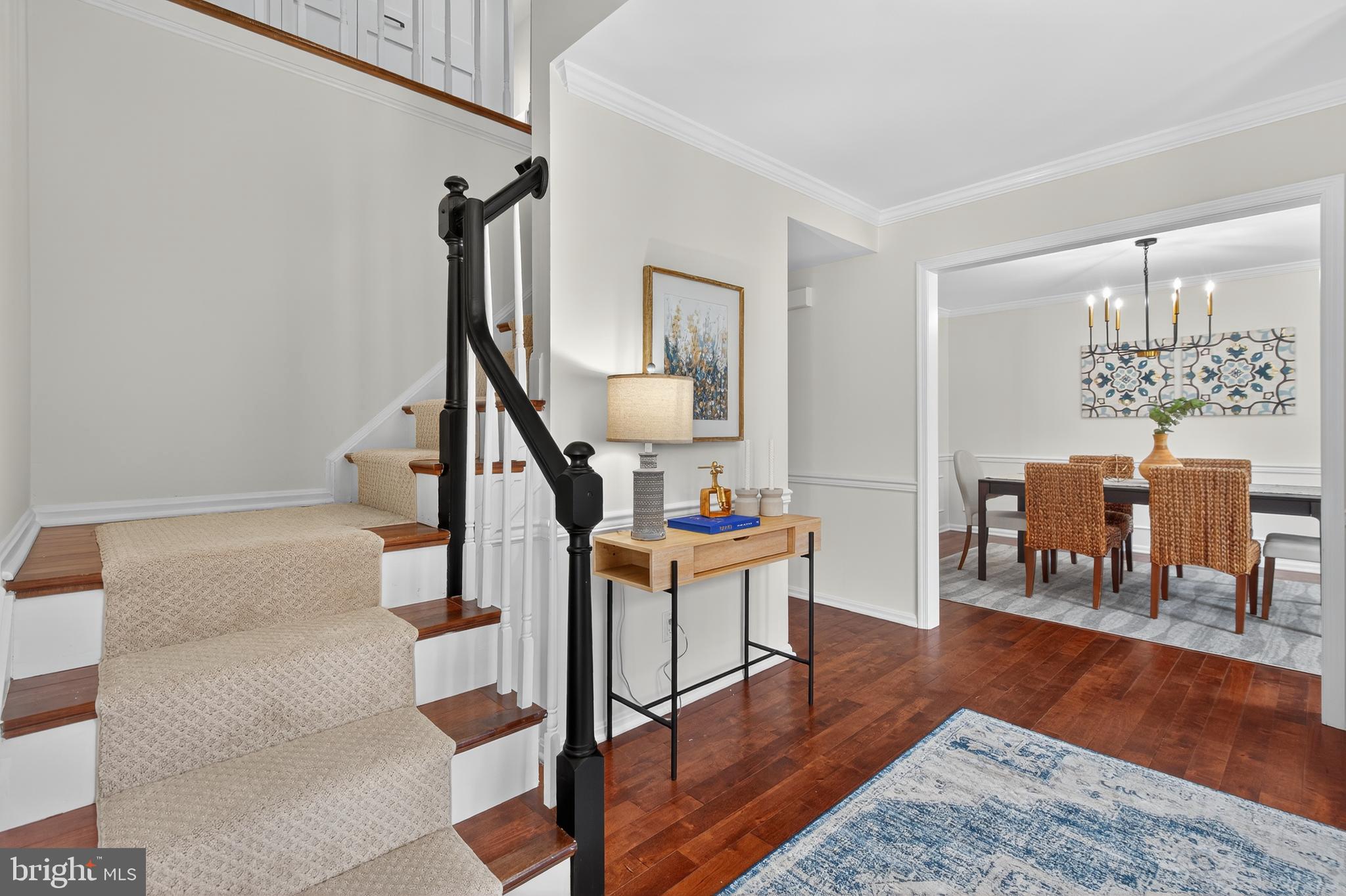 12100 Triple Crown Road North Potomac, MD 20878 - Photo 12 of 66 a view of a livingroom with furniture and wooden floor