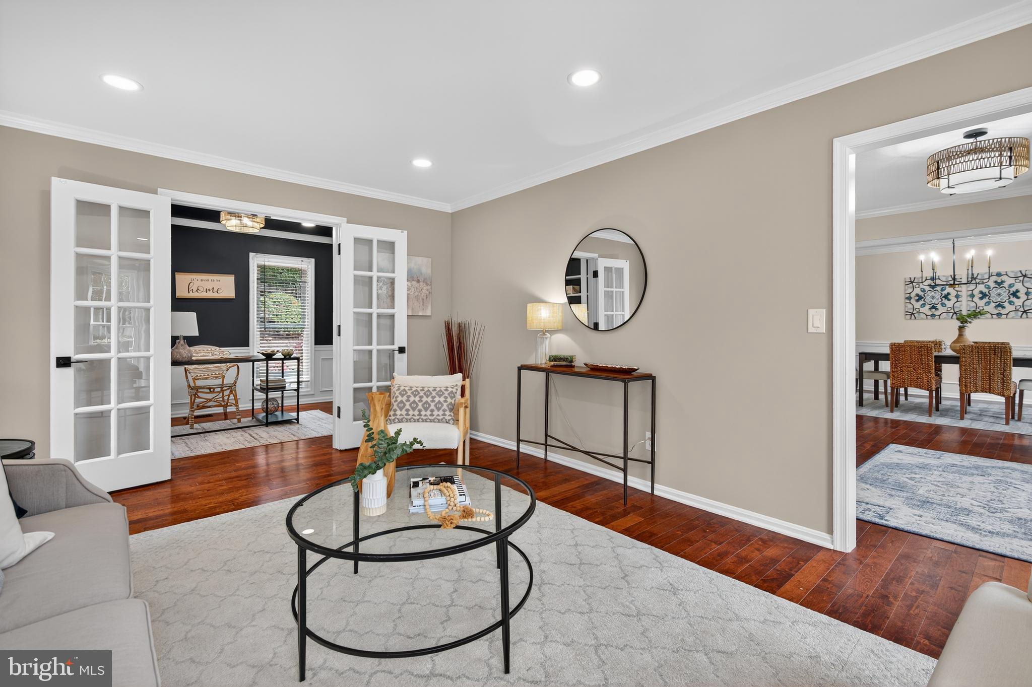 12100 Triple Crown Road North Potomac, MD 20878 - Photo 16 of 66 a living room with furniture a rug and a large window