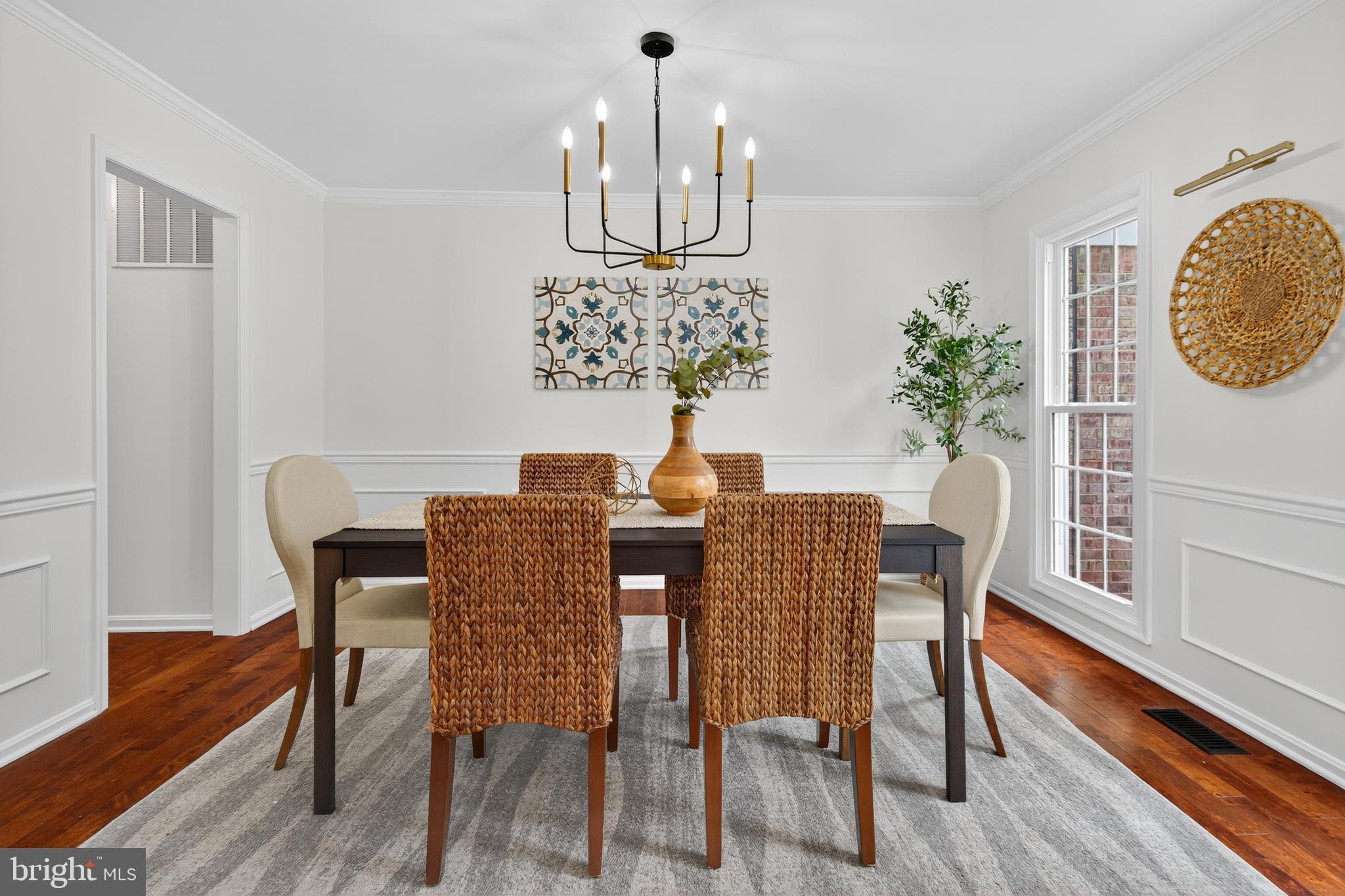 12100 Triple Crown Road North Potomac, MD 20878 - Photo 19 of 66 a view of a dining room with furniture and wooden floor