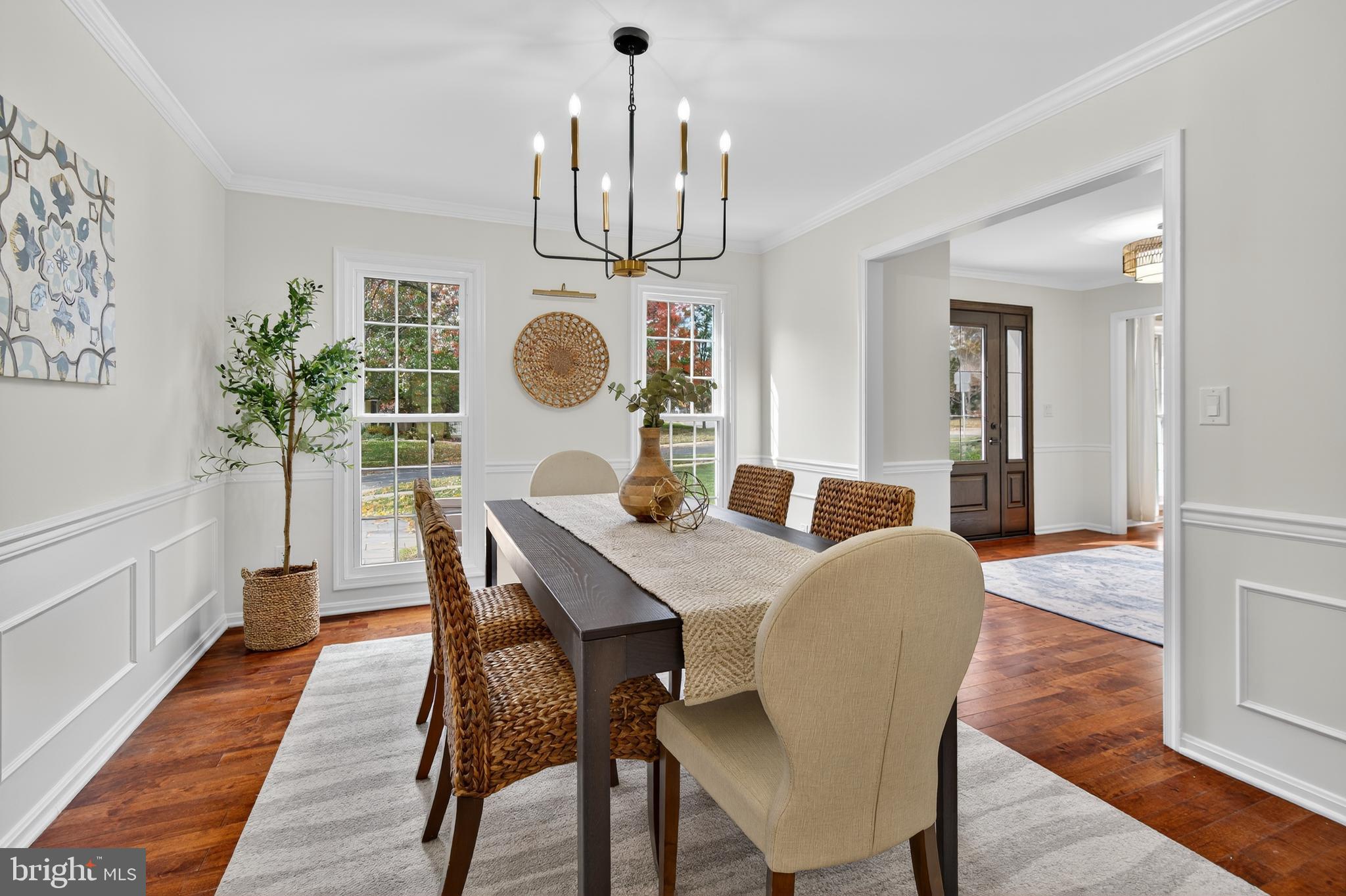 12100 Triple Crown Road North Potomac, MD 20878 - Photo 20 of 66 a view of a dining room with furniture and wooden floor