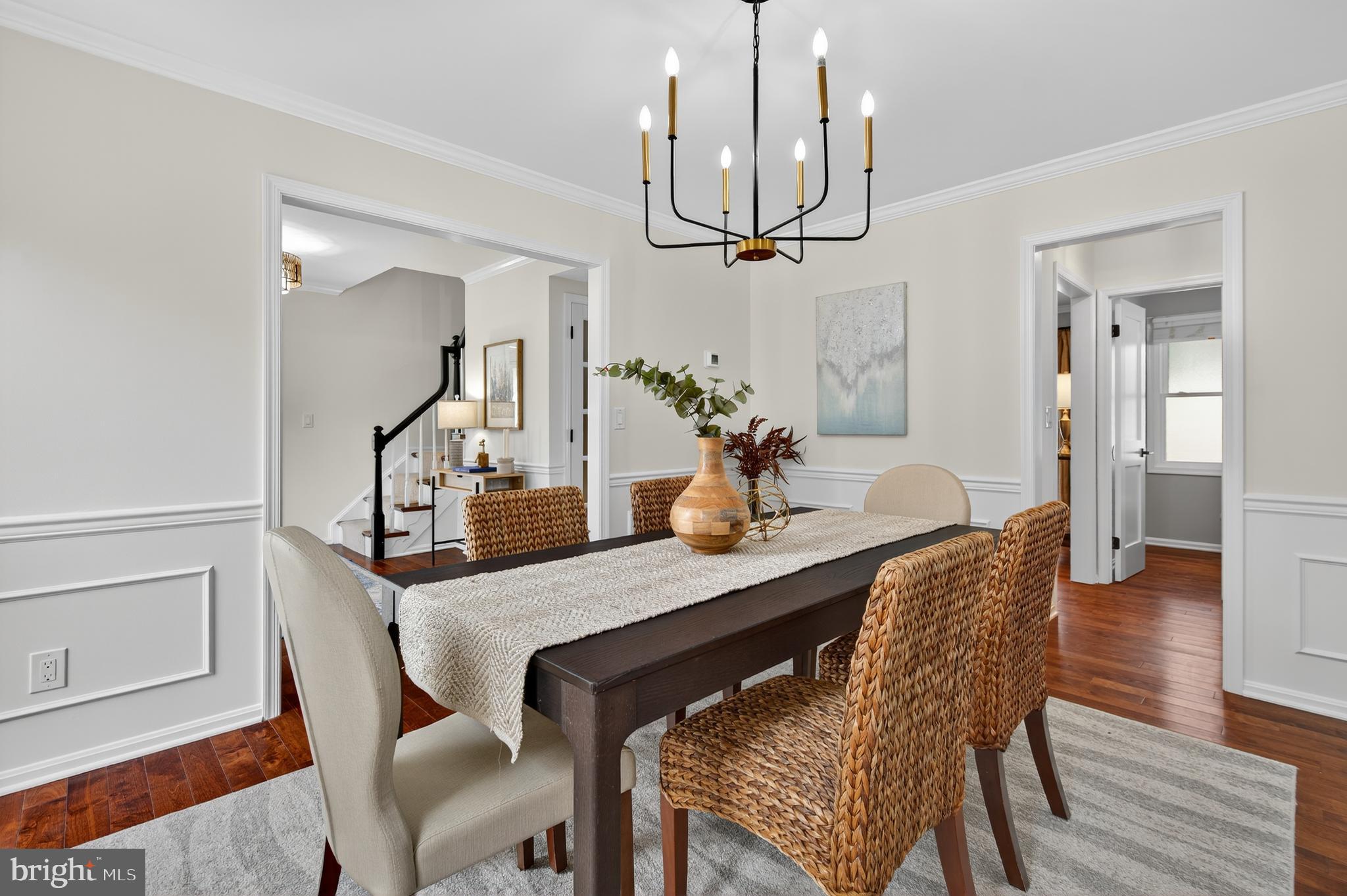 12100 Triple Crown Road North Potomac, MD 20878 - Photo 21 of 66 a view of a dining room with furniture and wooden floor