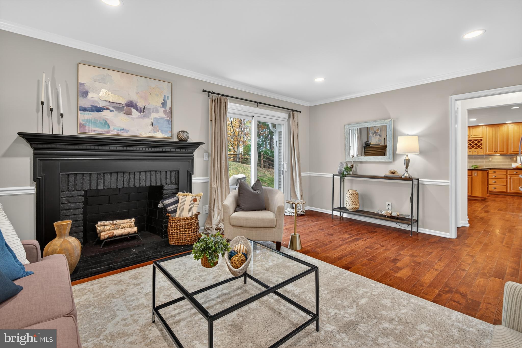 12100 Triple Crown Road North Potomac, MD 20878 - Photo 24 of 66 a living room with furniture and a fireplace