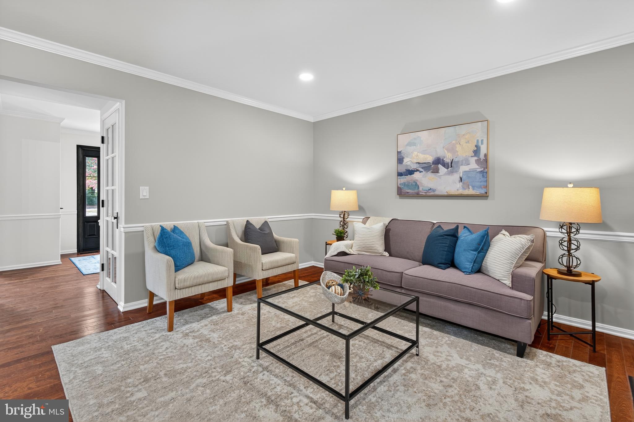 12100 Triple Crown Road North Potomac, MD 20878 - Photo 25 of 66 a living room with furniture a rug and a painting