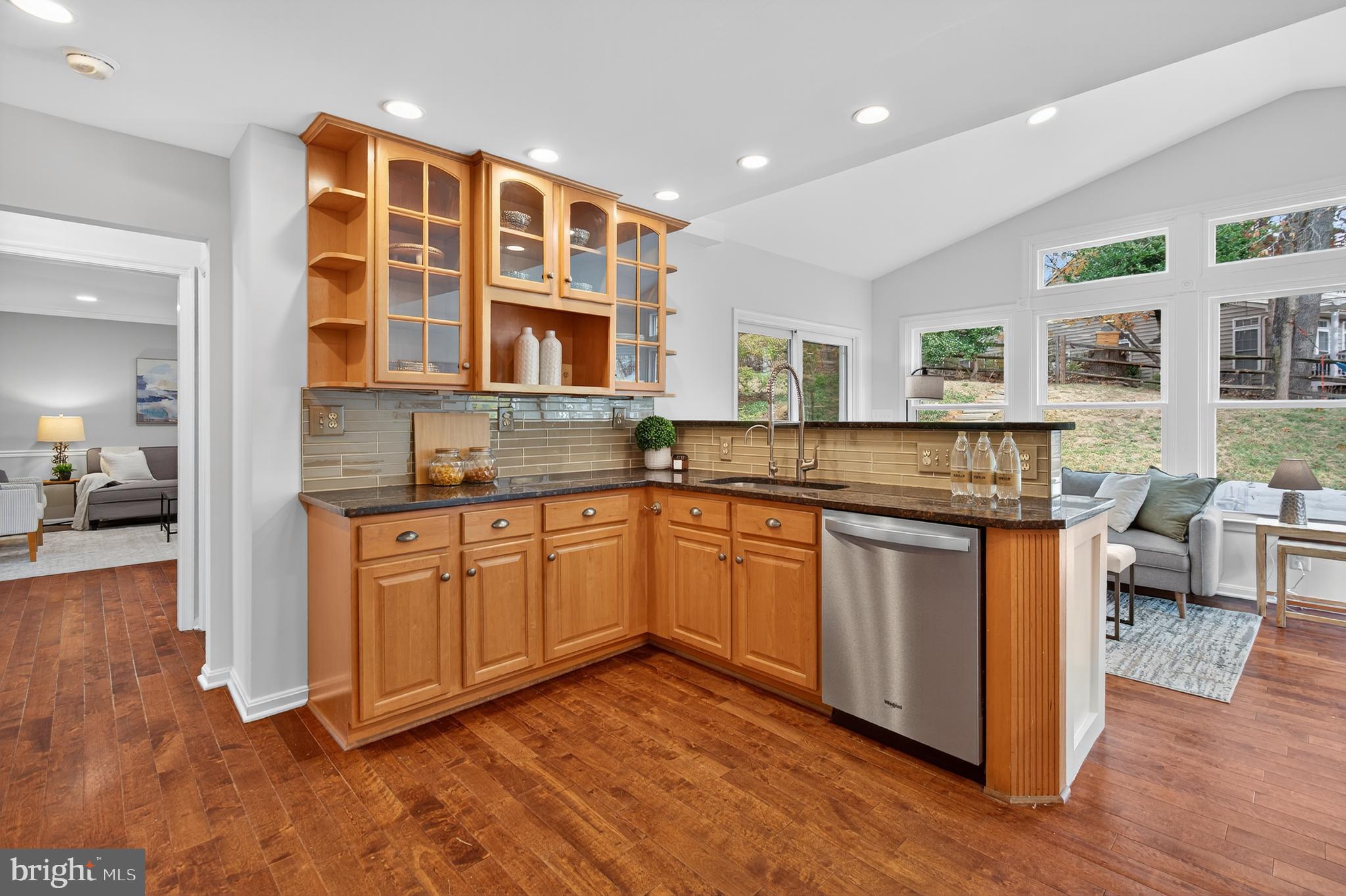 12100 Triple Crown Road North Potomac, MD 20878 - Photo 28 of 66 a kitchen with stainless steel appliances granite countertop a sink and cabinets