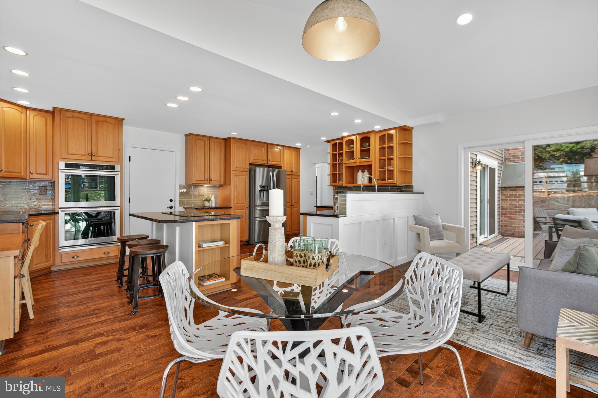 12100 Triple Crown Road North Potomac, MD 20878 - Photo 33 of 66 a view of a dining room with furniture window and wooden floor