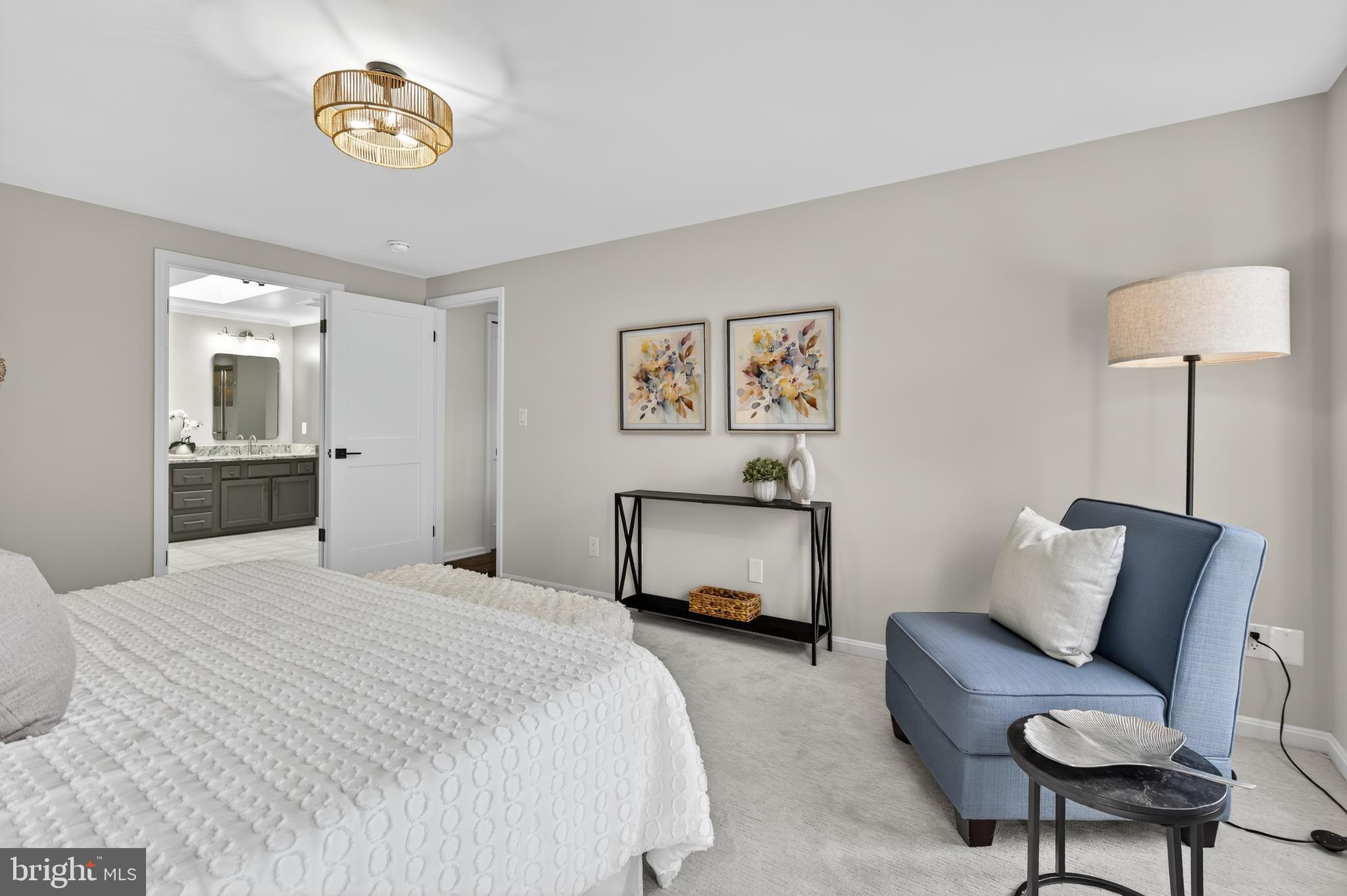 12100 Triple Crown Road North Potomac, MD 20878 - Photo 41 of 66 a bedroom with a bed and a chandelier