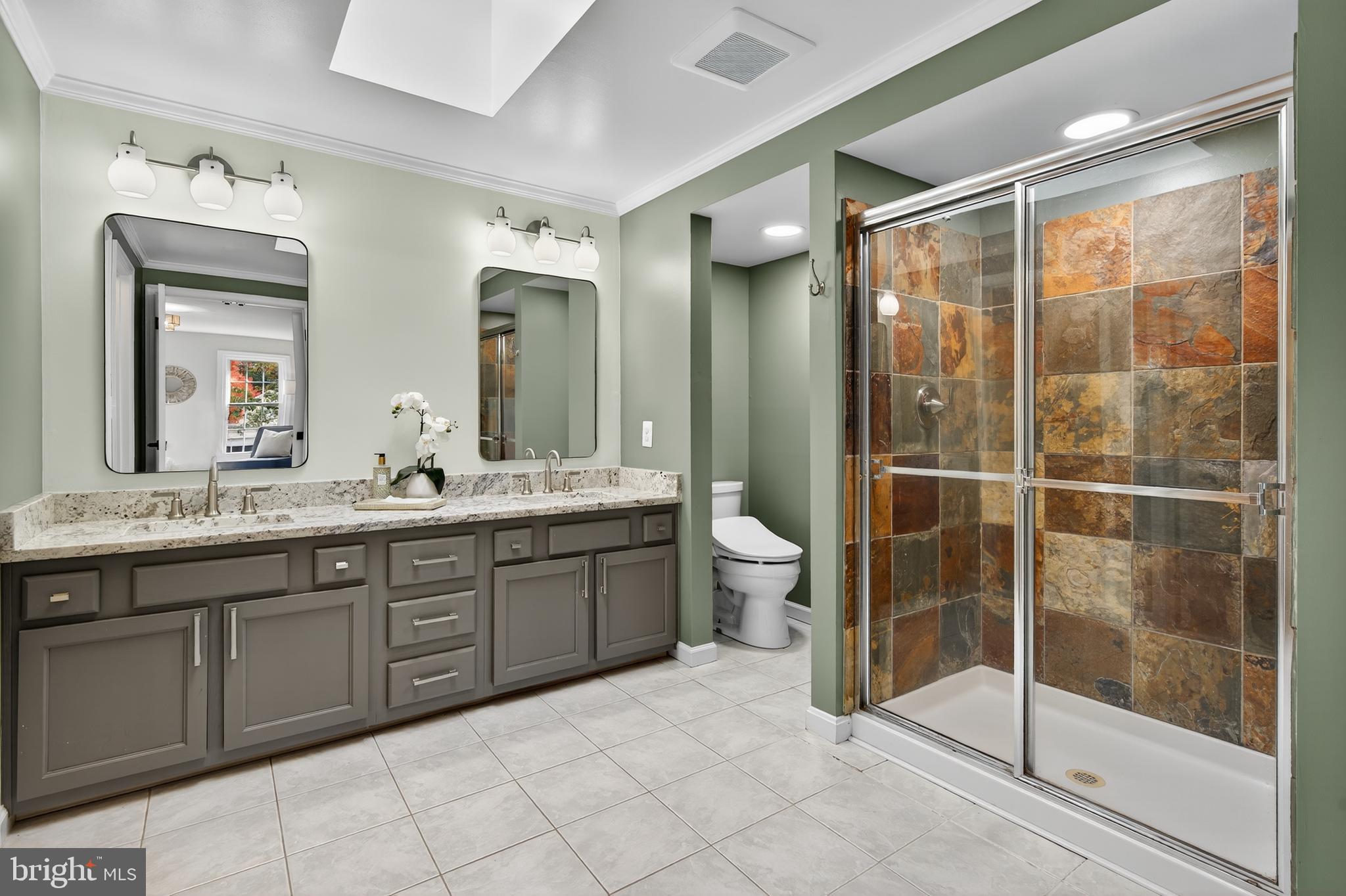 12100 Triple Crown Road North Potomac, MD 20878 - Photo 42 of 66 a bathroom with a double vanity sink mirror and toilet