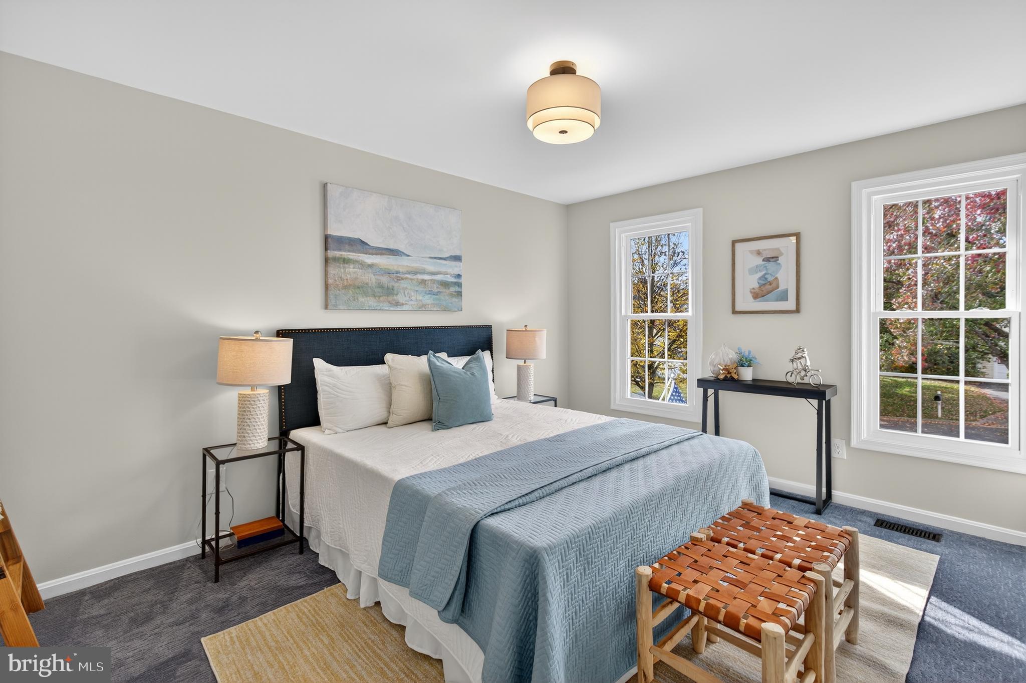 12100 Triple Crown Road North Potomac, MD 20878 - Photo 44 of 66 a bedroom with a bed and a lamp next to a window